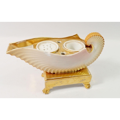 115 - A 19th century shell form gilt and cream inkwell, 13cm tall, 19cm wide