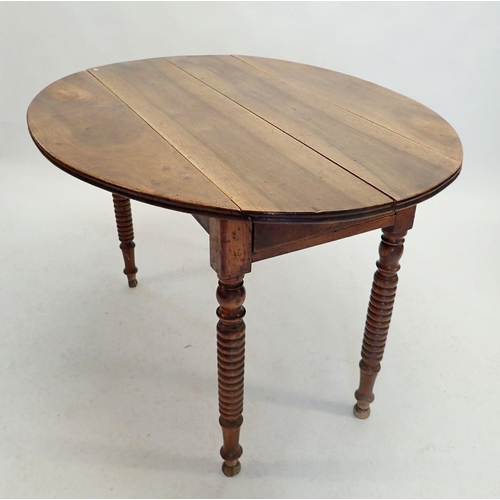 1215 - A French walnut dropleaf supper table with end drawer and turned supports, 72cm high