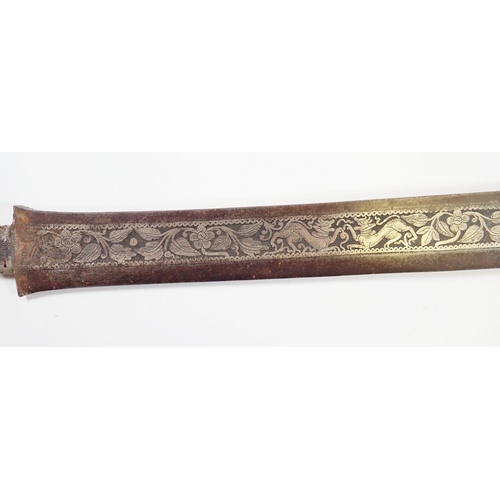 1232 - An antique Burmese sword or dha, the singe edge carved blade with foliage, floral and animal decorat... 