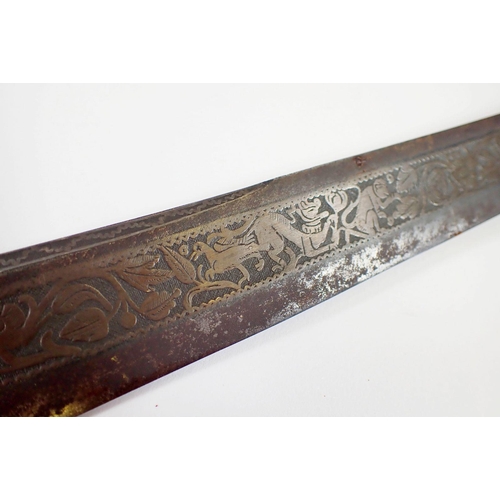 1233 - An antique Burmese sword or dha, the singe edge curved blade decorated animals, flowers and foliage ... 