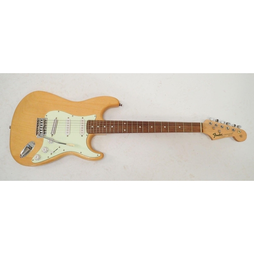 1236 - A Fender Stratocaster style electric guitar with wooden body, 98cm long