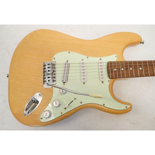 1236 - A Fender Stratocaster style electric guitar with wooden body, 98cm long