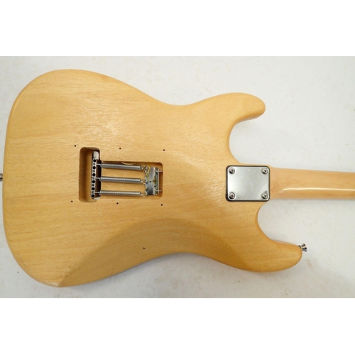 1236 - A Fender Stratocaster style electric guitar with wooden body, 98cm long