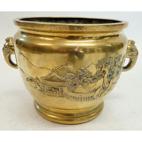 1241 - A 19th century Japanese brass jardiniere with elephant handles and landscape scenes, 29cm diameter