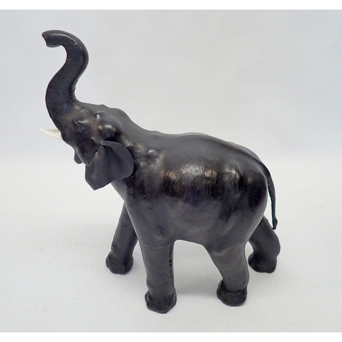 1244 - A vintage leather clad elephant, 73cm tall