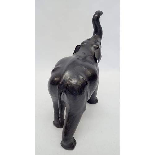 1244 - A vintage leather clad elephant, 73cm tall