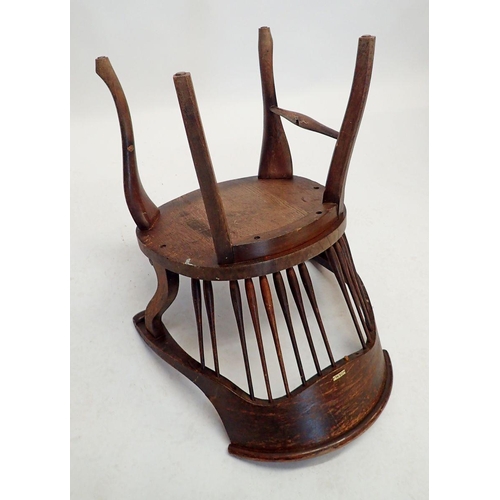 1263 - A late 19th century French oak spindle back Captain's chair on cabriole supports, some spindles miss... 