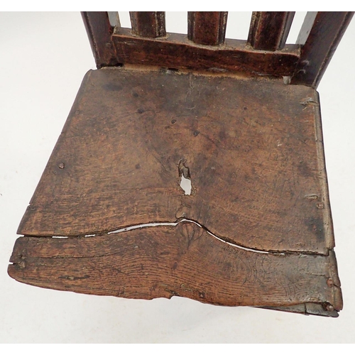 1277 - A mid 17th century provincial oak slat back chair