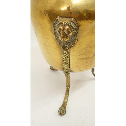 1291 - A brass jardiniere on tall lion mask and paw supports, 44cm