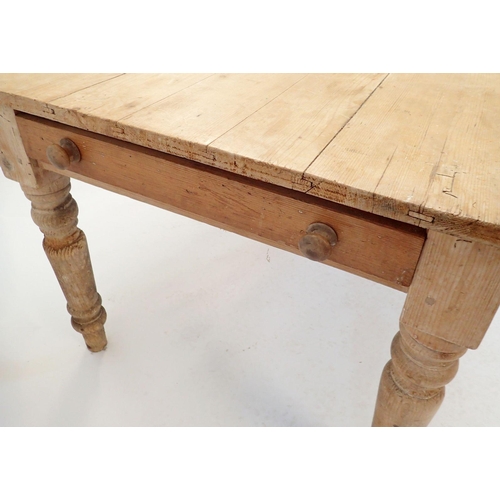 1293 - A pine farmhouse style table on turned supports, 90 x 153cm