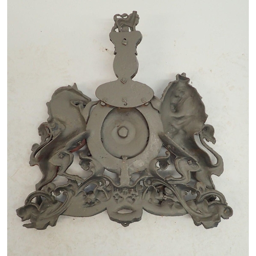 1310 - A large cast iron over lintel Royal Heraldic crest with lion and unicorn, now painted grey, 58 x 55c... 