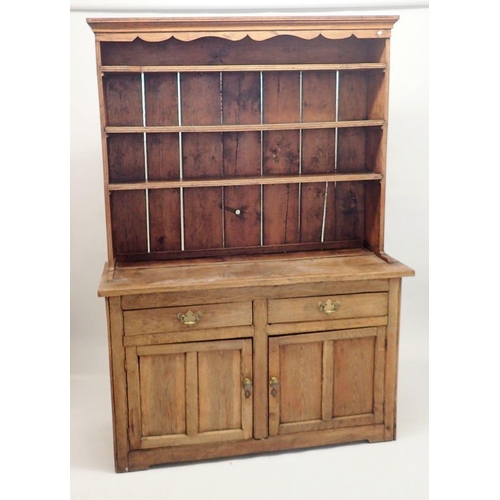 1315 - An 18th century elm and pine Welsh dresser with three tier back over two short drawers and two panel... 