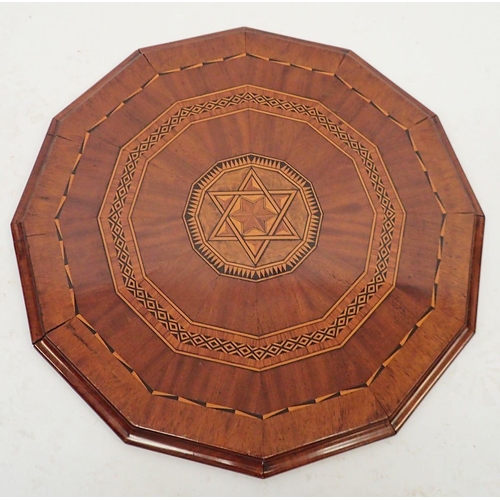 1329 - A 19th century mahogany marquetry double sided table top, 56cm diameter