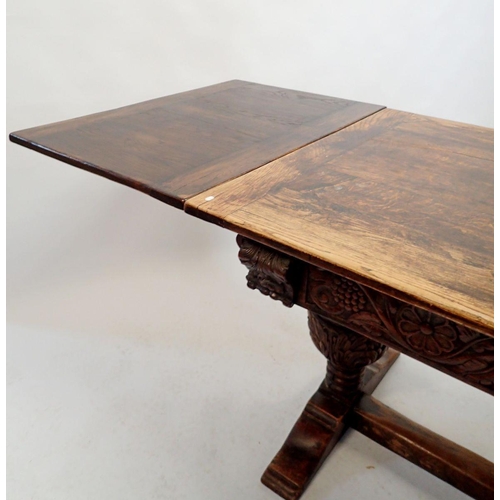 1332 - An oak Elizabethan style drawleaf refectory table on large carved cup and cover supports, 151 x 86cm... 