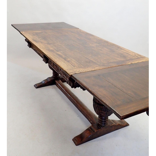 1332 - An oak Elizabethan style drawleaf refectory table on large carved cup and cover supports, 151 x 86cm... 