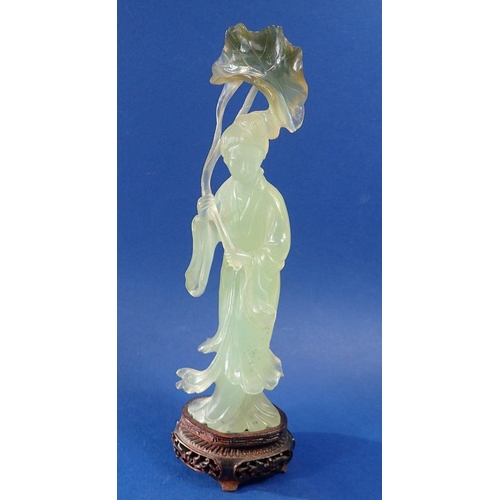 1334 - An early 20th century Chinese carved jade figure of a lady holding a lily leaf on carved stand, 26.5... 