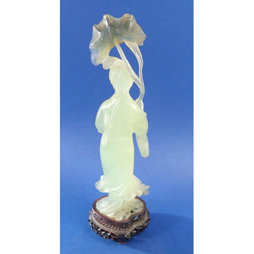 1334 - An early 20th century Chinese carved jade figure of a lady holding a lily leaf on carved stand, 26.5... 