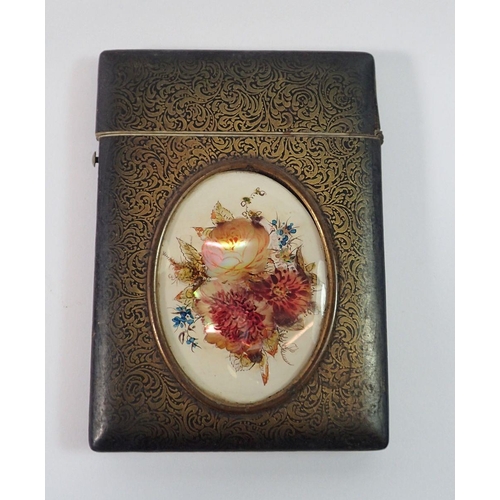 1343 - A 19th century lacquered bone card case inset oval mother of pearl floral painted panel