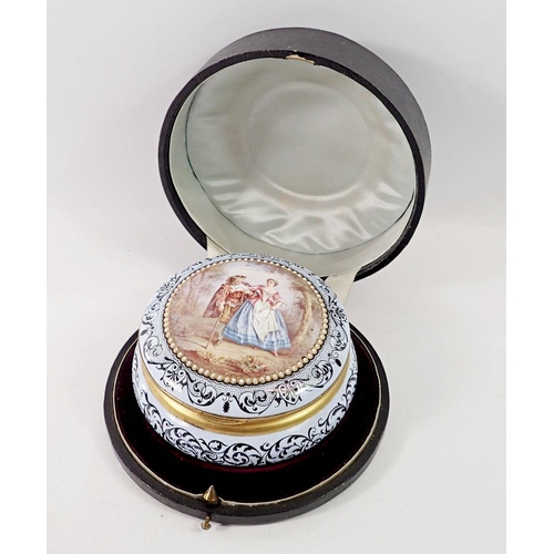 1346 - An enamel circular box painted romantic scene in fitted case (restored) 11cm diameter