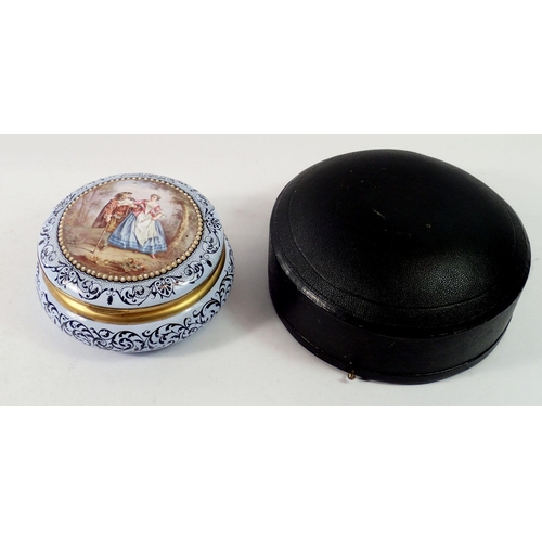 1346 - An enamel circular box painted romantic scene in fitted case (restored) 11cm diameter