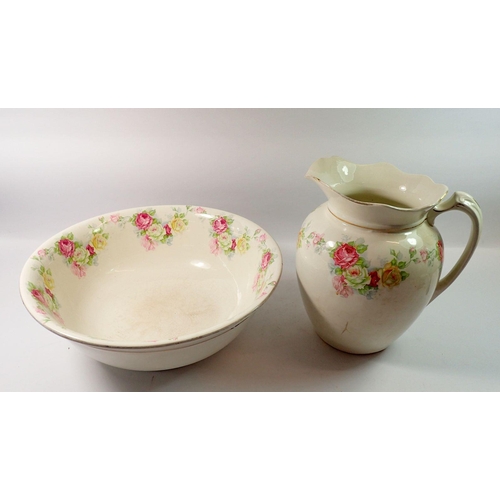 154 - A Victorian toiletry bowl and jug printed roses