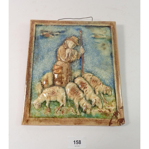 158 - A Karlsruhe  Majolica wall plaque depicting Shepherd and Sheep, signed, 24 x 22cm - damaged