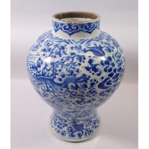 172 - A Qing Dynasty Chinese blue and white baluster vase and cover painted birds and flowers, 41cm