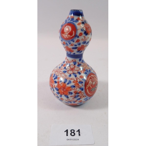 181 - A Japanese double gourd form miniature vase, 10cm tall