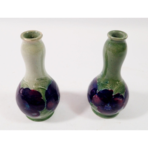 186 - A pair of Moorcroft miniature pansy vases, 8.5cm tall