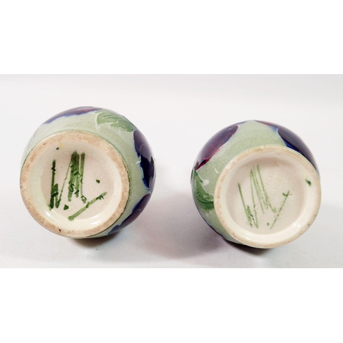 186 - A pair of Moorcroft miniature pansy vases, 8.5cm tall