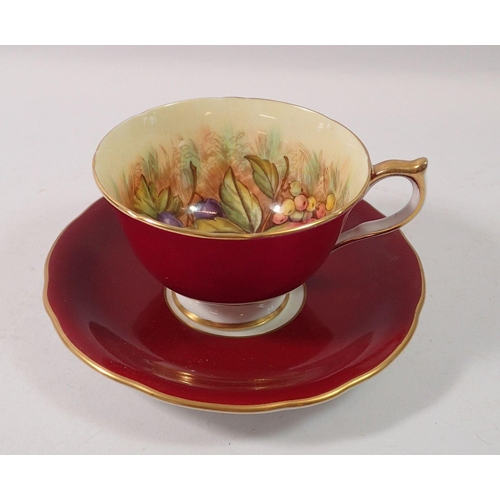 188 - An Anysley tea cup and saucer printed fruit, by James