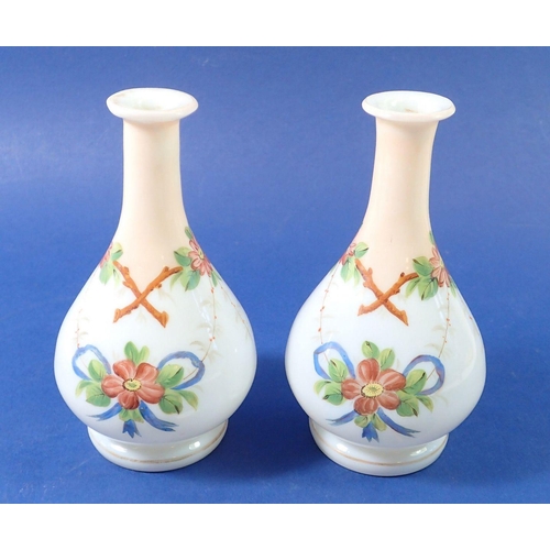 203 - A pair of floral painted opaque glass vases, 15cm