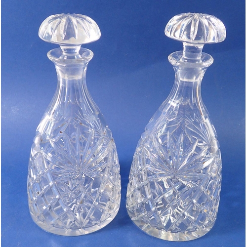 213 - A pair of cut glass mallet form decanters