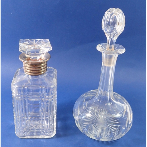 214 - A silver plated and cut glass spirit decanter, 30cm and an Edwardian decanter, 22cm