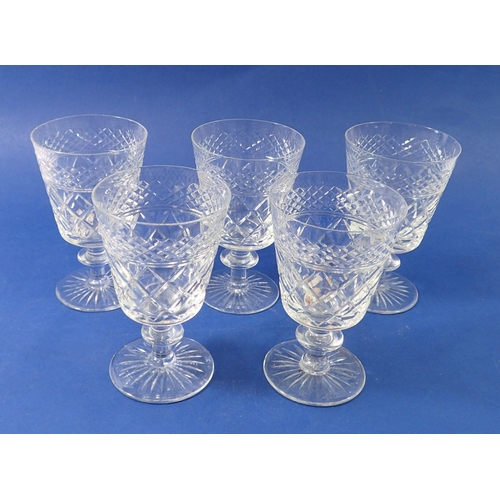 216 - A set of five cut glass bucket form wine glasses