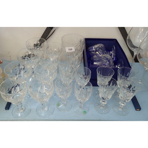 226 - A suite of drinking glasses by Royal Brierley, Stuart Crystal and a mixed pair of brandy glasses fro... 