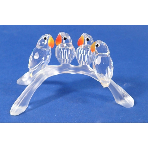 238 - A Swarovski glass group of birds on a branch, 10cm - boxed