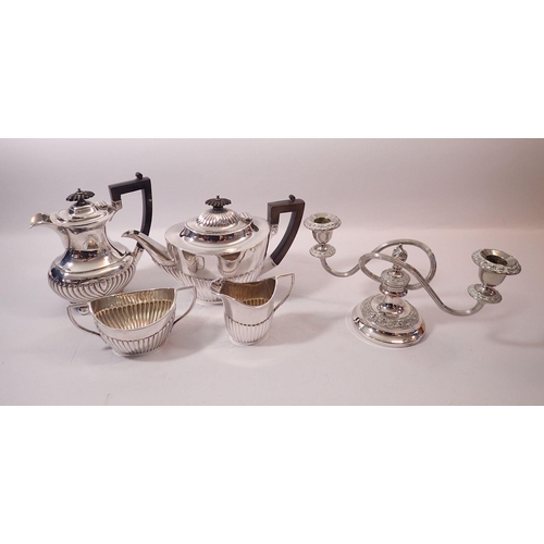 253 - A Mappin & Webb three piece silver plated tea service, a coffee pot and candleabra