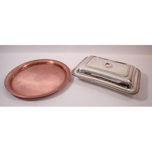 255 - A copper circular tray and a silver plated entree dish