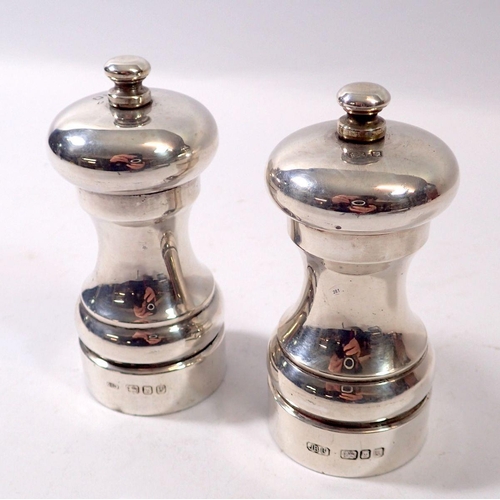 281 - A pair of silver salt and pepper grinders, London 1995 & 1996, John Bull Ltd.