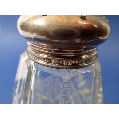 282 - A Victorian cranberry glass smelling salts bottle with silver plated mounts, two other smelling salt... 