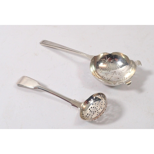 291 - A silver tea strainer, Sheffield 1938 and a silver Georgian sifter spoon, 64g