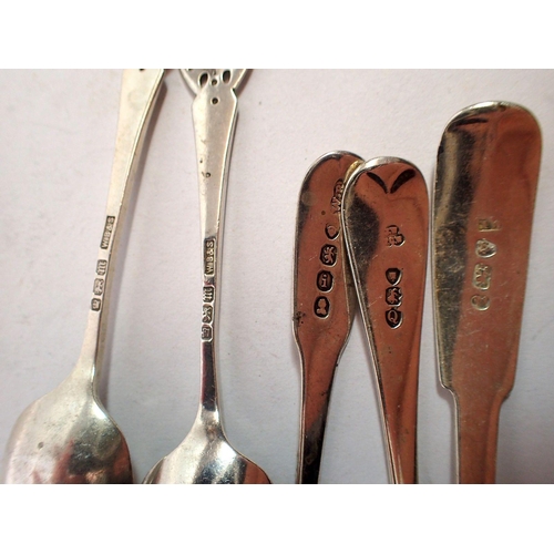 295 - A collection of four various silver spoons, 75g including Georgian Newcastle sauce ladle, maker TW