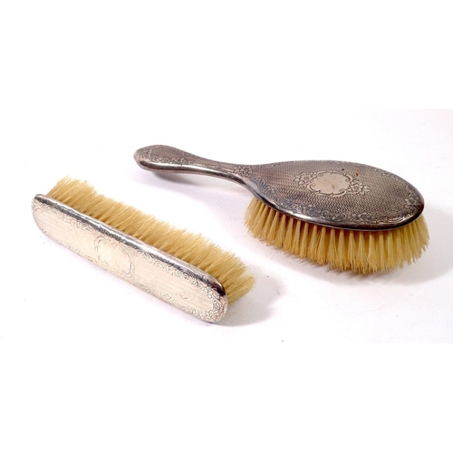 302 - Two silver backed brushes