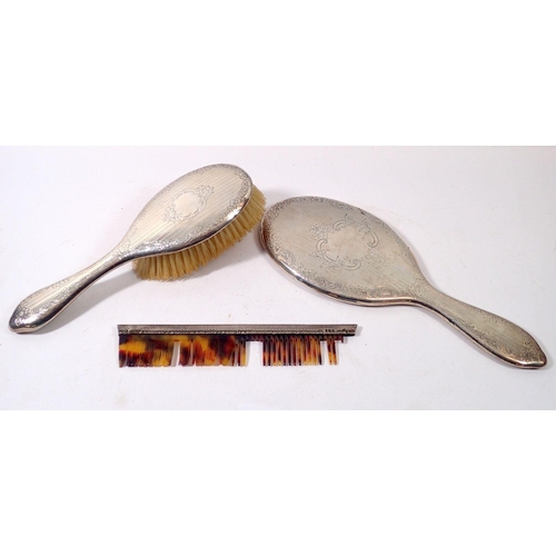 307 - A silver brush and mirror set