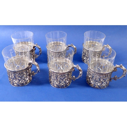 310 - A set of six German 800 standard large silver tumbler holders with pierced trellis and swags of frui... 