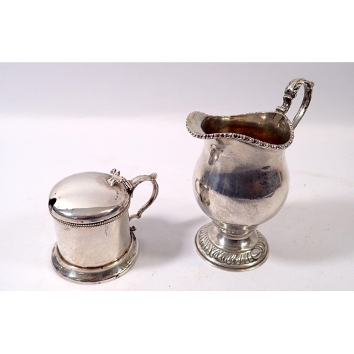 313 - A silver jug Birmingham 1947 and a Victorian silver mustard pot, London 1861, 310g with blueglass li... 