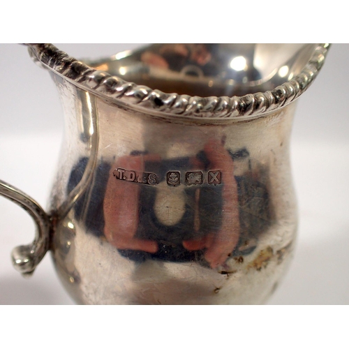 313 - A silver jug Birmingham 1947 and a Victorian silver mustard pot, London 1861, 310g with blueglass li... 