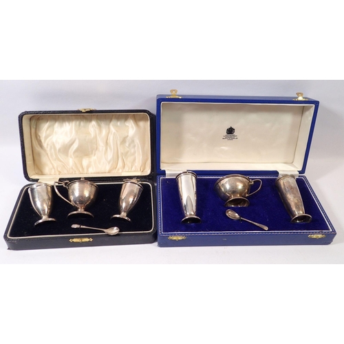 314 - Two boxed three piece silver cruet sets, Birmingham 1932 and 1965