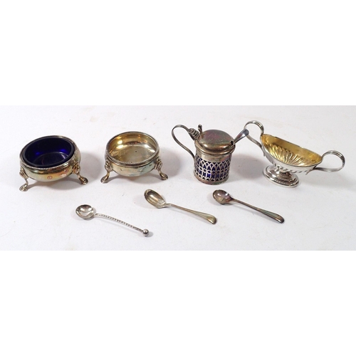 315 - A pair of circular silver salts (only one liner) plus a blue glass lined mustard pot and a silver ov... 